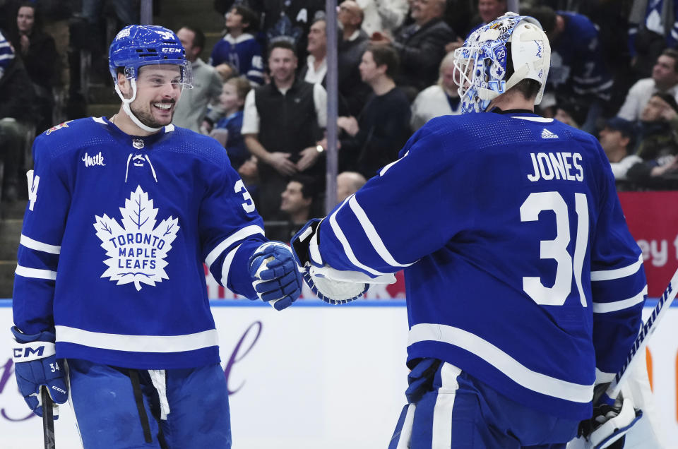 Toronto Maple Leafs forward Auston Matthews (34) celebrates his goal against the San Jose Sharks with goaltender Martin Jones (31) during the first period of an NHL hockey game, Tuesday, Jan. 9, 2024 in Toronto. (Nathan Denette/The Canadian Press via AP)