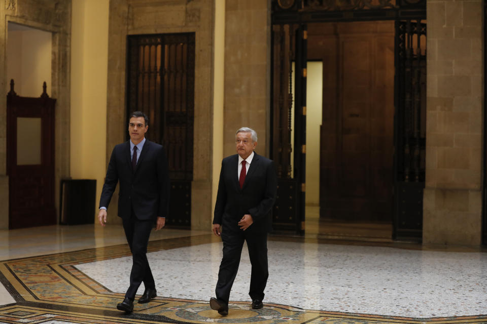 Spain’s Prime Minister Pedro Sanchez, left, and Mexican President Andres Manuel Lopez Obrador arrive to give a joint statement inside the National Palace in Mexico City, Wednesday, Jan. 30, 2019. Sanchez is on an official visit to Mexico. (AP Photo/Marco Ugarte)