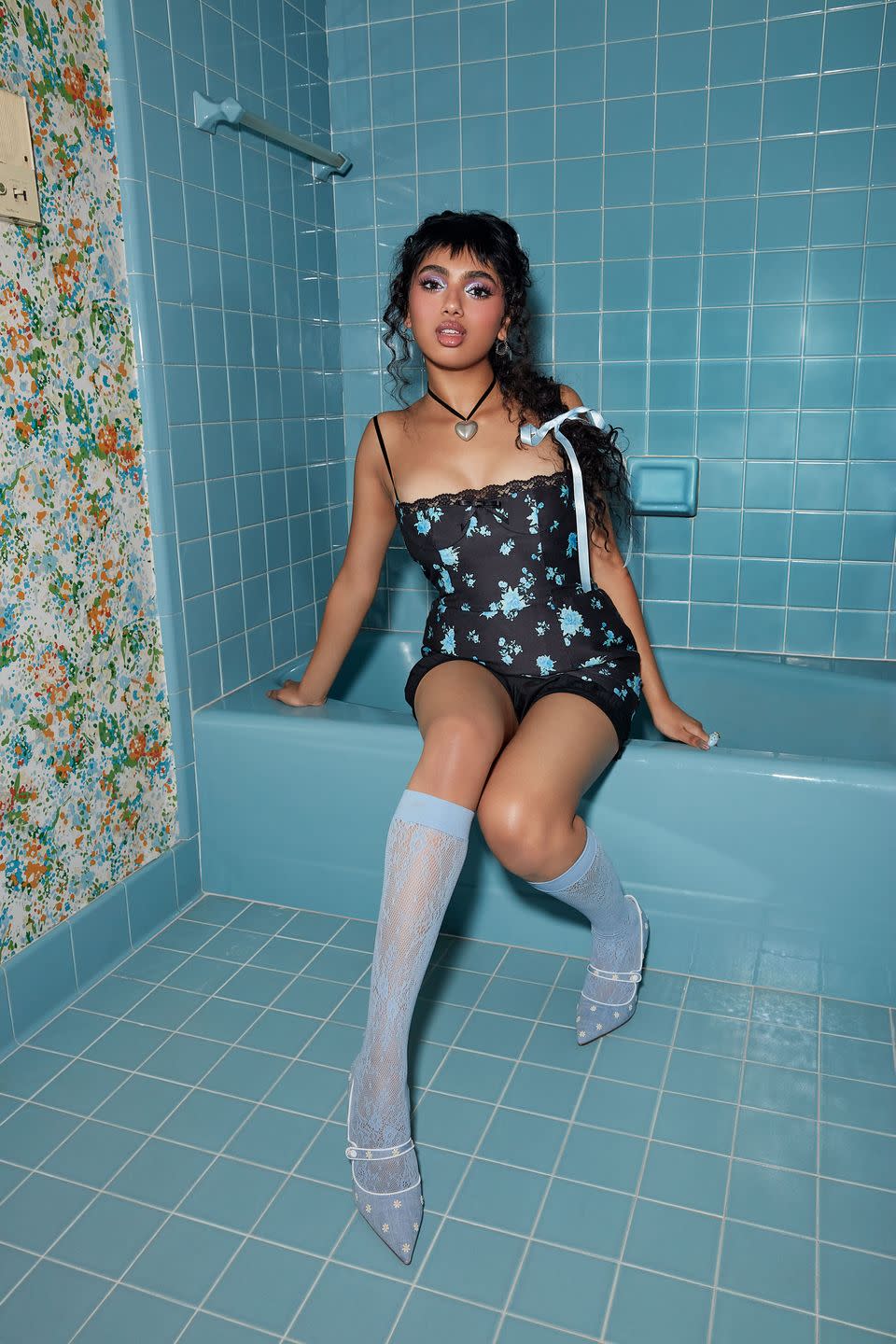 a woman sitting on a bathtub