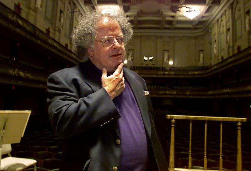 FILE PHOTO: James Levine pauses as he looks over the stage and conductor's podium in Boston's Symphony Hall