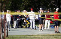 <p>A person is loaded on a stretcher as members of the Republican congressional baseball team look on following a shooting in Alexandria, Va, June 14, 2017. (Photo: Shawn Thew/EPA) </p>