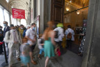 Visitors arrive on the reopening day of the Uffizi museum, in Florence, Italy, Wednesday, June 3, 2020. The Uffizi museum reopened to the public after over two months of closure due to coronavirus restrictions. (AP Photo/Andrew Medichini)