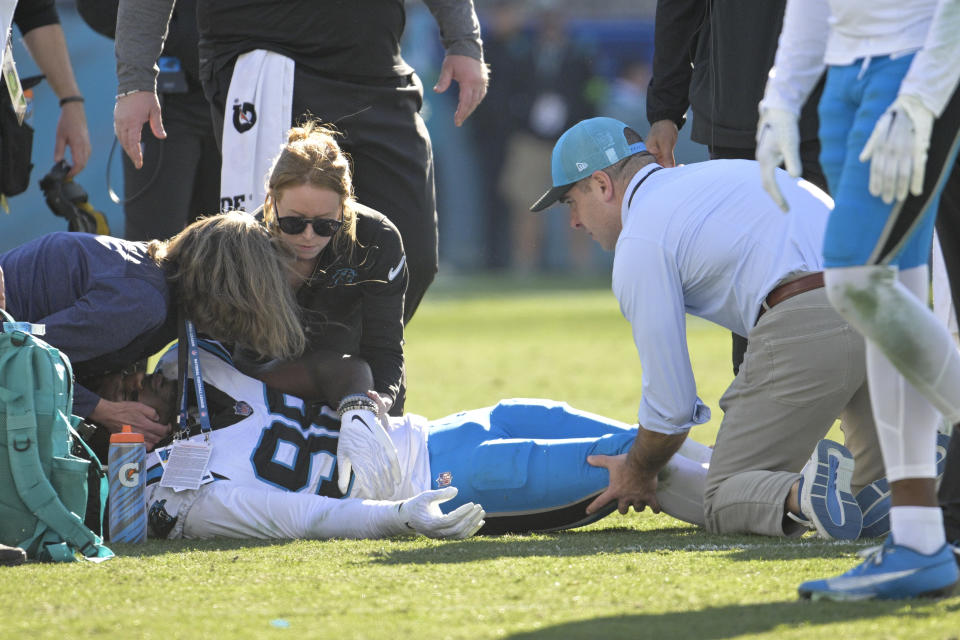Carolina Panthers linebacker Marquis Haynes Sr. is treated after getting hurt during the second half of an NFL football game against the Jacksonville Jaguars Sunday, Dec. 31, 2023, in Jacksonville, Fla. (AP Photo/Phelan M. Ebenhack)