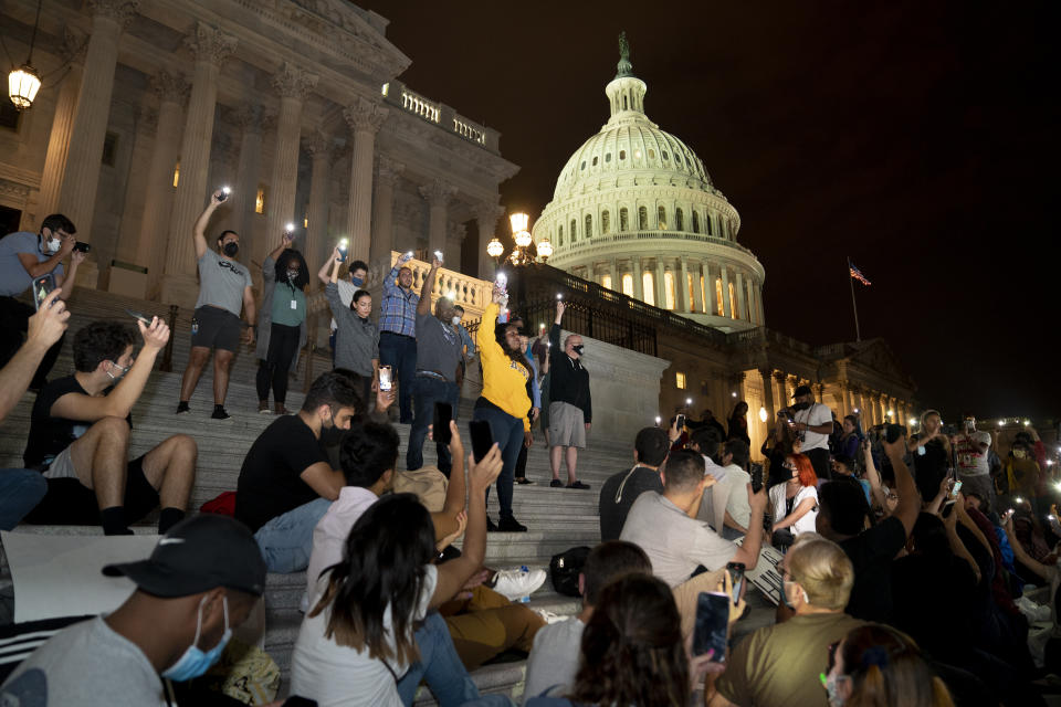 Alexandria Ocasio-Cortez, Jamaal Bowman, Cori Bush,  Sara Jacobs, a Democrat from California, and Jim McGovern, a Democrat from Massachusetts, participate in a protest against the expiration of the eviction moratorium outside of the U.S. Capitol in Washington, D.C., U.S., on Sunday, Aug. 1, 2021. (Stefani Reynolds/Bloomberg via Getty Images)