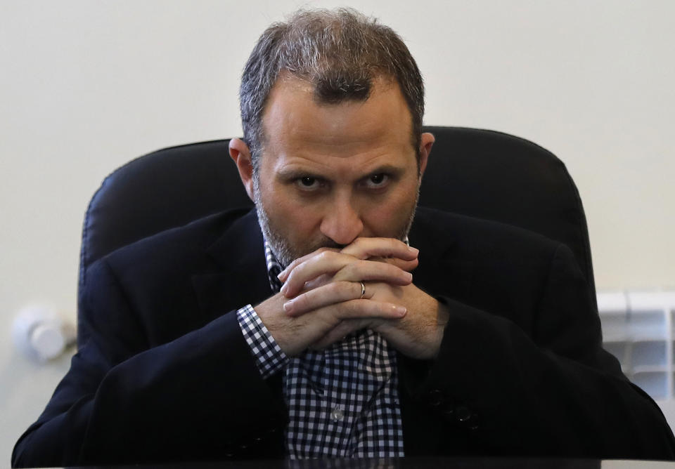 FILE - In this June 13, 2018 file photo, Lebanese Foreign Minister Gibran Bassil pauses during a news conference at a Syrian refugee camp, in Arsal, near the border with Syria, east Lebanon. The U.S. treasury slapped sanctions Friday, Nov. 6, 2020, on Lebanon's ex-foreign minister and a leading Christian political ally of the Hezbollah group, according to the Treasury's website. (AP Photo/Hussein Malla, File)