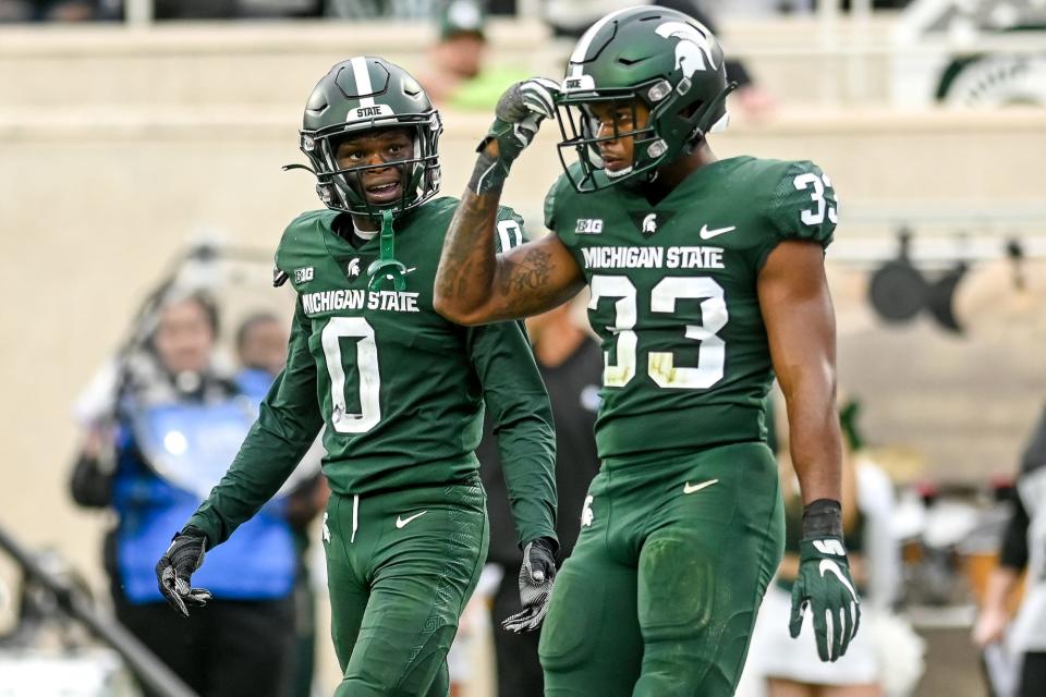 Michigan State's Charles Brantley, left, and Kendell Brooks, right, walk back to the sideline after Minnesota's Nick Kallerup's touchdown during the third quarter on Saturday, Sept. 24, 2022, at Spartan Stadium in East Lansing.