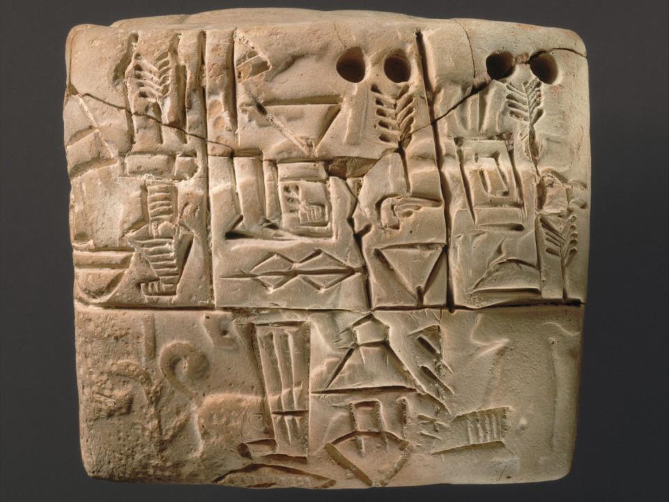 An ancient Sumerian tablet with cuneiform writing, recording barley distribution, from Mesopotamia, probably from Uruk (modern Warka), dating to around 3100–2900 BC,
