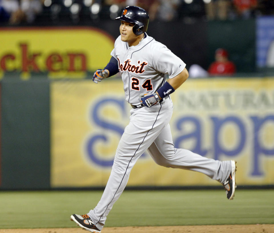 FILE - Detroit Tigers Miguel Cabrera rounds the bases after hitting his second home run of the game in the fifth inning of a baseball game against the Texas Rangers, May 19, 2013, in Arlington, Texas. Cabrera, one of the greatest hitters of all time, is retiring after the Tigers wrap up their season Sunday, Oct. 1, 2023, and baseball’s last Triple Crown winner is leaving a lasting legacy in the game and his native Venezuela. (AP Photo/John F. Rhodes, File)