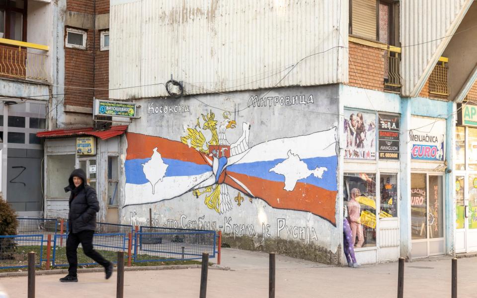 A mural which reads 'Kosovo is Serbian, Crimea is Russian' in Mitrovica, northern Kosovo - Heathcliff O'Malley