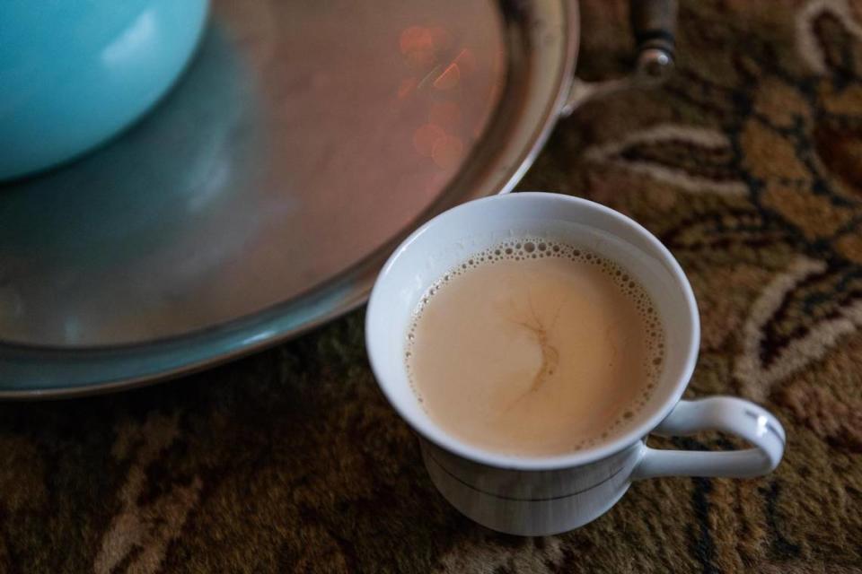 A fresh cup of Sheer Chai Afghan milk tea is poured for guests in Mohammad Amini’s apartment living room in Fort Worth on Sept. 27, 2023.