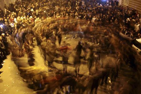 People dance as they celebrate in Kurdish-dominated Diyarbakir in southeastern Turkey, after Kurdish forces took full control of the Syrian town of Kobani, January 26, 2015. Kurdish forces took full control of Kobani on Monday, driving out remaining Islamic State fighters to end a four-month battle that became a focal point of the international fight against the ultra-hardline Islamist group. REUTERS/Sertac Kayar