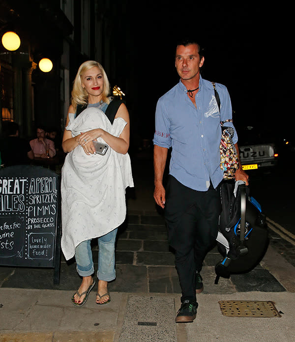 Gwen cradles 1-year-old son Apollo on date night with Gavin in London on July 12th.