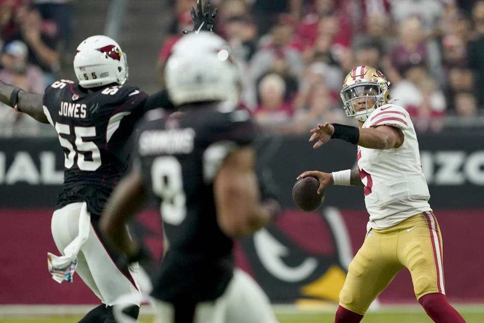 San Francisco 49ers quarterback Trey Lance (5) throws under pressure from Arizona Cardinals linebacker Chandler Jones (55) during the second half of an NFL football game, Sunday, Oct. 10, 2021, in Glendale, Ariz. (AP Photo/Darryl Webb)