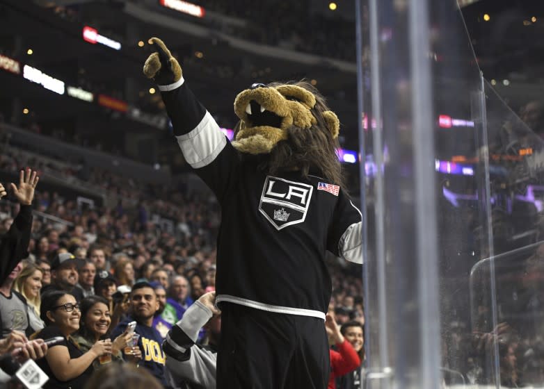 Los Angeles Kings mascot Bailey entertains the crowd during a preseason NHL hockey game against the Anaheim Ducks, Saturday, Sept. 30, 2017, in Los Angeles. (AP Photo/Michael Owen Baker)