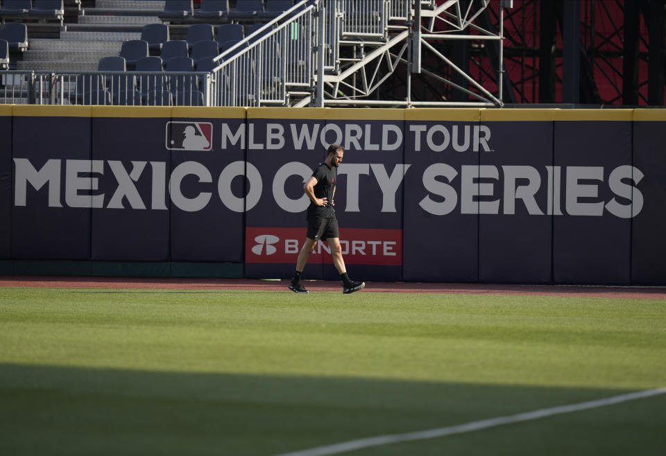 San Francisco Giants pitcher Tristan Beck walks along the field during a practice session at Alfredo Harp Helu Stadium in Mexico City, Friday, April 28, 2023. (AP Photo/Fernando Llano)