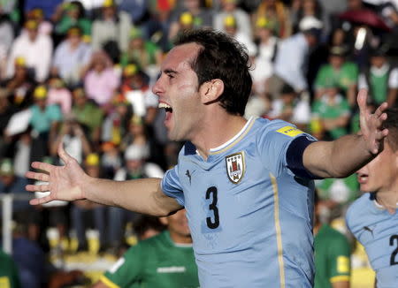 Diego Godin of Uruguay celebrates after scoring against Bolivia during their 2018 World Cup qualifying soccer match at the Hernando Siles Stadium in La Paz, Bolivia October 8, 2015. REUTERS/David Mercado