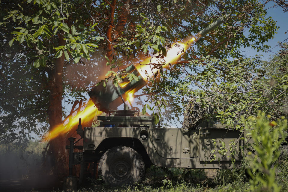 Ukrainian soldiers fire a Croatian RAK-SA-12 128mm multiple rocket launcher towards the Russian positions on the frontline near Bakhmut in the Donetsk region, Ukraine, Monday, July 10, 2023. (Roman Chop via AP)