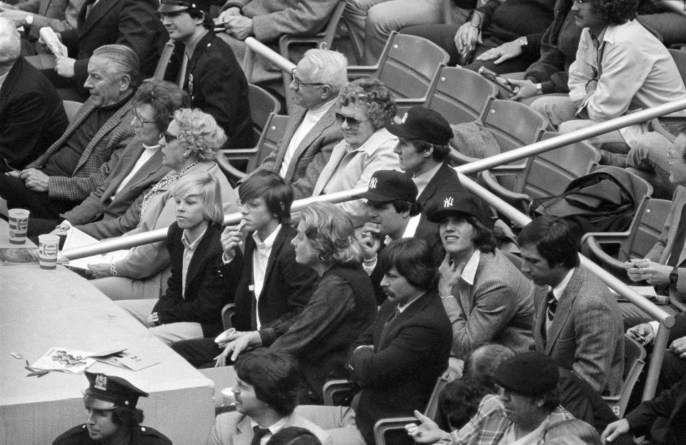 <p>Team USA member Eric Heiden was accompanied by captain Eruzione and Coach Brooks as they helped throw the first pitch at the New York Yankee’s April 19th, 1980 home opener against the Milwaukee Brewers. It was the first baseball game that Heiden had ever attended. </p>