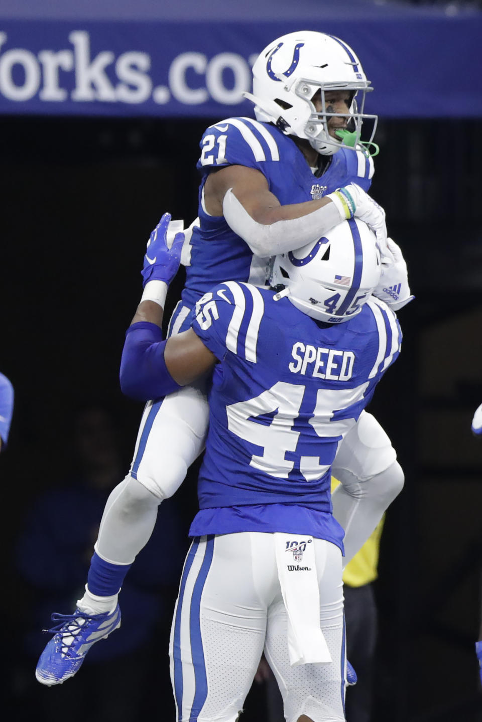Indianapolis Colts' Nyheim Hines (21) celebrates with E.J. Speed (45) after running back a punt for a touchdown during the second half of an NFL football game against the Carolina Panthers, Sunday, Dec. 22, 2019, in Indianapolis. (AP Photo/Michael Conroy)