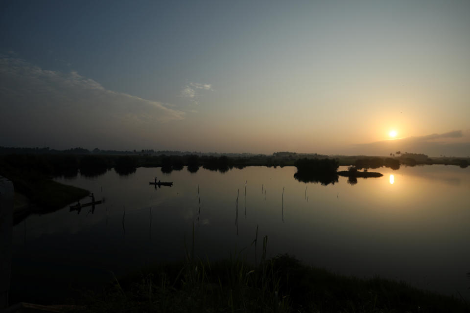 A canoe is seen a lake beside the track leading to the "Door of No Return" where slaves were loaded onto ships in the historic slave port town Ouidah, Benin. (Photo: Afolabi Sotunde/Reuters)