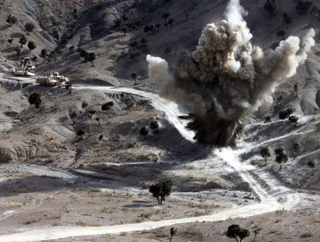 FILE PHOTO: U.S. soldiers blows up a roadside bomb set up by Taliban fighters near the town of Walli Was in Paktika province, near the border with Pakistan, November 4, 2012. Picture taken November 4, 2012. REUTERS/Goran Tomasevic/File Photo