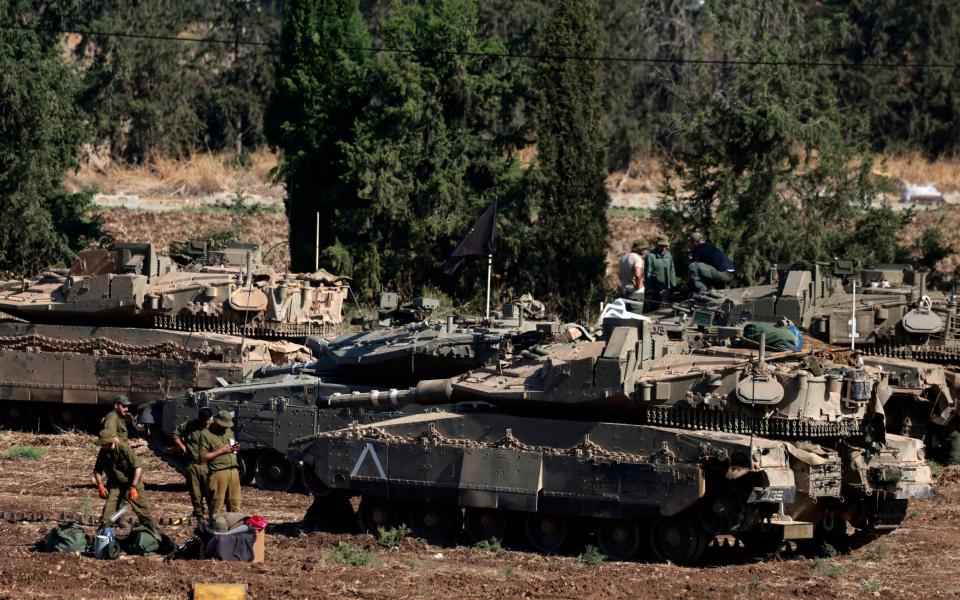 sraeli army tanks are deployed in the Upper Galilee region of northern Israel near the border with Lebanon