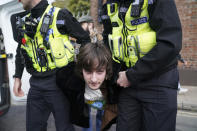 <p>Police detain a protester after he appeared to throw eggs at Britain's King Charles III and the Queen Consort as they arrived for a ceremony at Micklegate Bar, where the Sovereign is traditionally welcomed to the city, in York, England, Wednesday Nov. 9, 2022. (Jacob King/PA via AP)</p> 