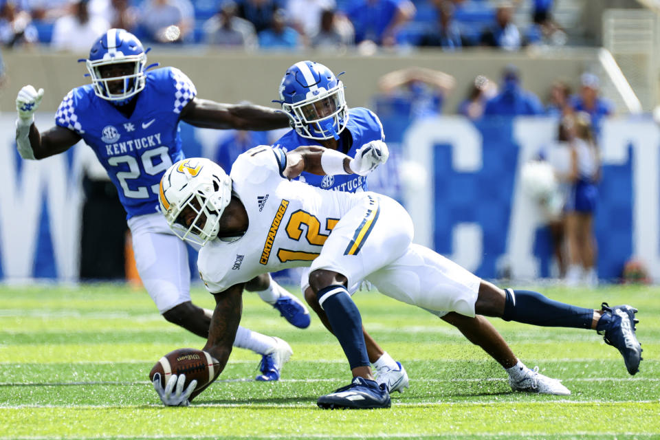 Chattanooga wide receiver Reginald Henderson (12) makes a diving catch during the first half of a NCAA college football game against Kentucky in Lexington, Ky., Saturday, Sept. 18, 2021. (AP Photo/Michael Clubb)