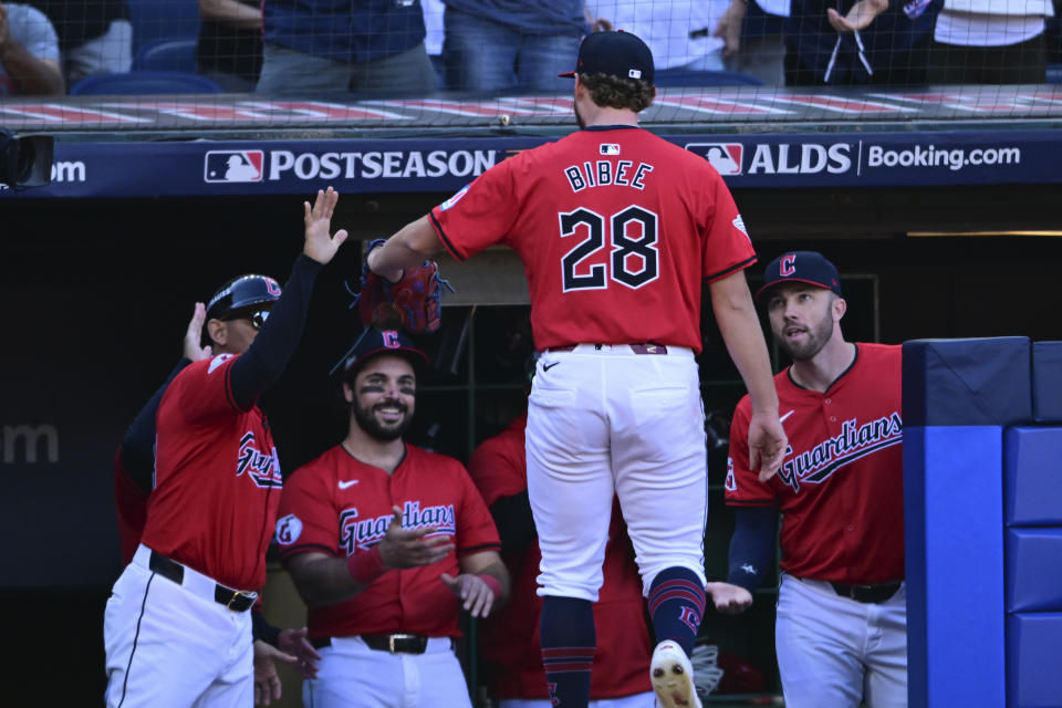 Cleveland Guardians starting pitcher Tanner Bibee is greeted as he returns to the dugout after being taken out of the game in the fifth inning during Game 1 of baseball's AL Division Series against the Detroit Tigers, Saturday, Oct. 5, 2024, in Cleveland. (AP Photo/David Dermer)