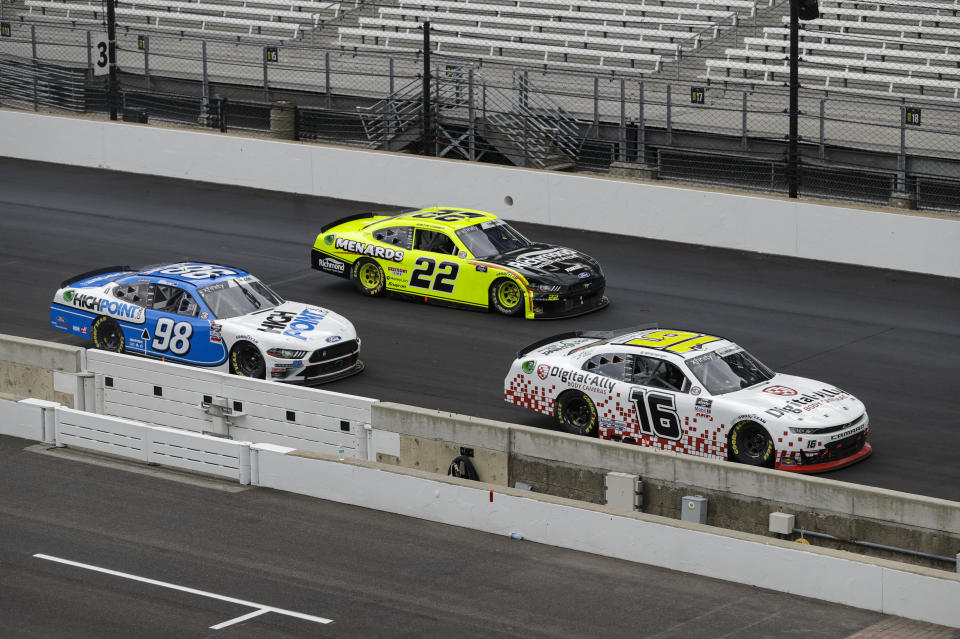 NASCAR Xfinity Series drivers AJ Allmendinger (16), Austin Cindric (22) and Chase Briscoe (98) battle for the lead in the closing laps the NASCAR Xfinity Series auto race at Indianapolis Motor Speedway in Indianapolis, Saturday, July 4, 2020. (AP Photo/Darron Cummings)