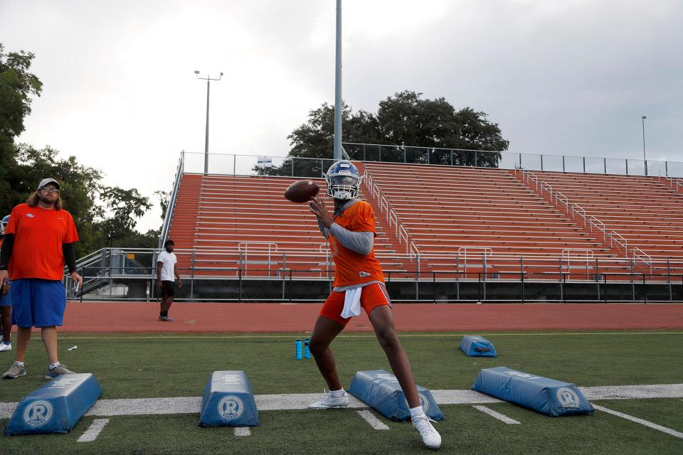 Savannah State quarterback Jadon Adams passes the ball as he runs through a drill during practice at TA Wright Stadium.