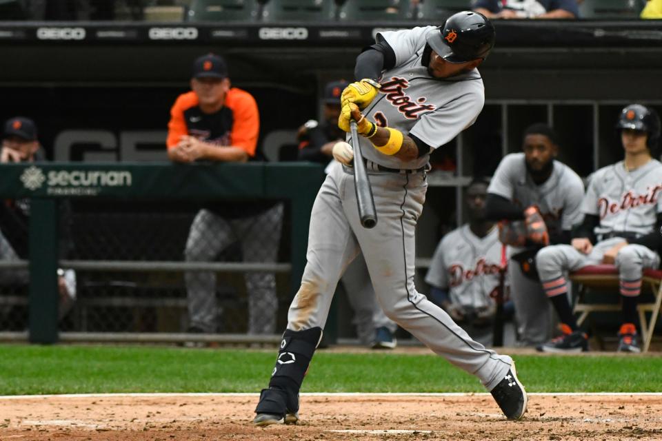 Detroit Tigers' Harold Castro hits a sacrifice fly RBI during the fifth inning of a baseball game against the Chicago White Sox, Sunday, Oct. 3, 2021, in Chicago.