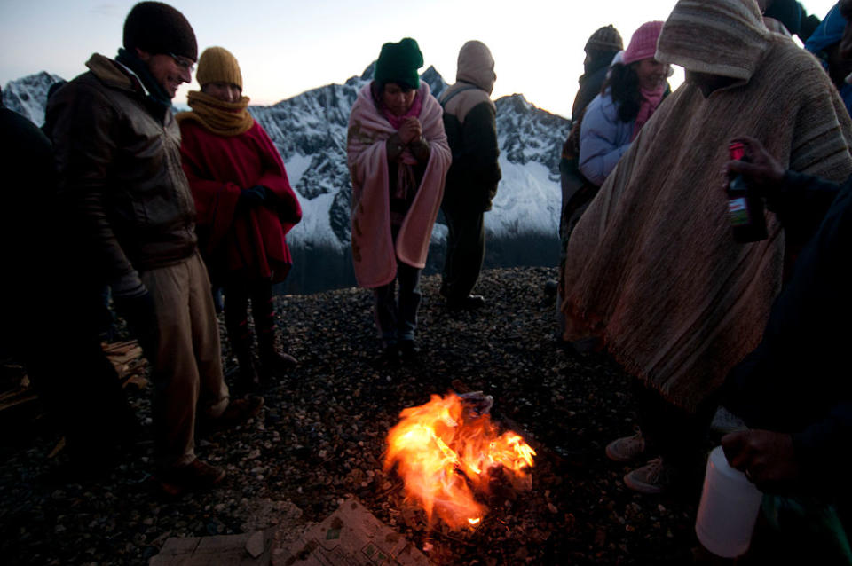 People gather around a small fire, and make offerings to Pachamama, Mother Earth. Source: Getty (file photo)