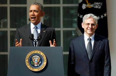 President Barack Obama (L) announces Judge Merrick Garland (R) as his nominee to the U.S. Supreme Court, in the White House Rose Garden in Washington, March 16, 2016. REUTERS/Kevin Lamarque