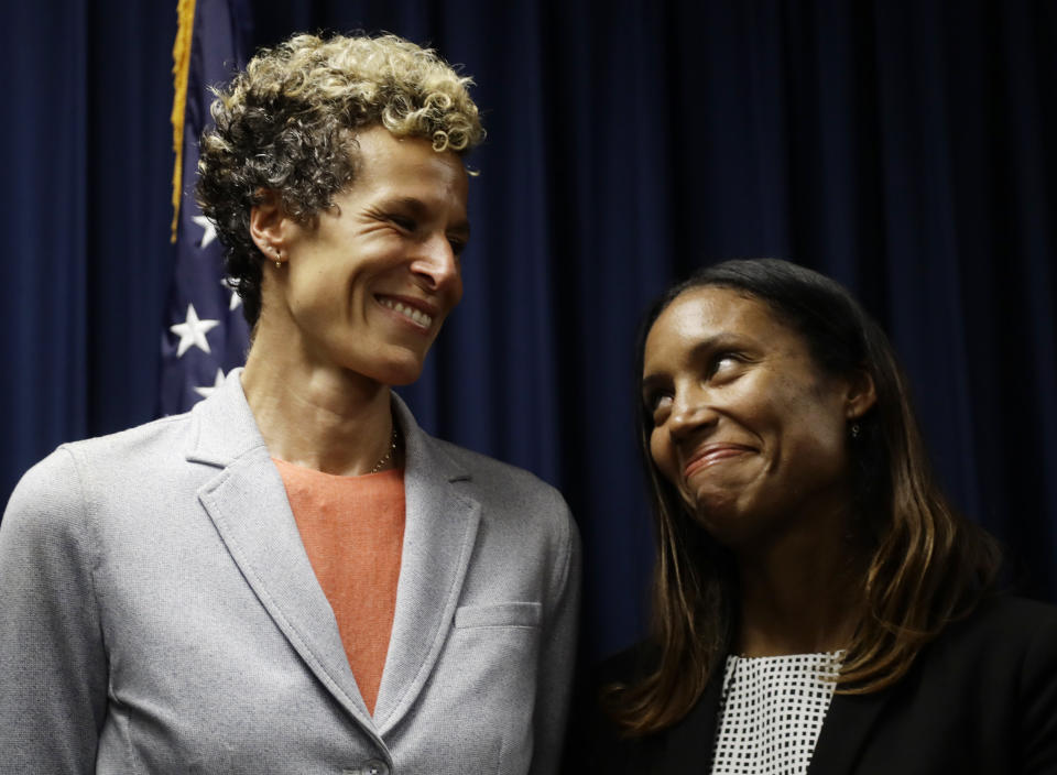 Accuser Andrea Constand, left, reacts at a news conference with prosecutor Kristen Feden after Bill Cosby was sentenced to three-to 10-years for sexual assault Tuesday, Sept. 25, 2018, in Norristown, Pa. (AP Photo/Matt Slocum)