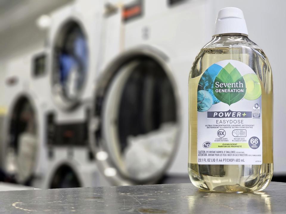 A bottle of Seventh Generation ultra concentrated laundry detergents sits on a table at a full service laundromat in Silver Lake area of Los Angeles on Wednesday, March 15, 2023. A growing number of companies are making bulky plastic jugs smaller and concentrating the detergent or soap. (AP Photo/Damian Dovarganes)