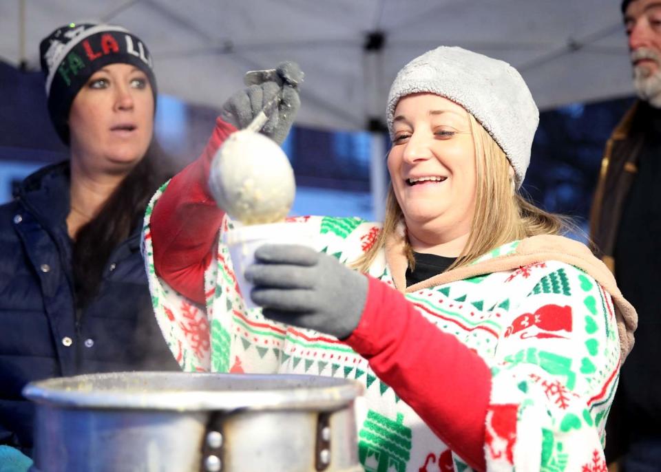 Krista White, of Rockland, serves her father’s homemade chowder to visitors with a smile during the annual Holiday Stroll in Rockland Saturday, Nov. 24, 2018.