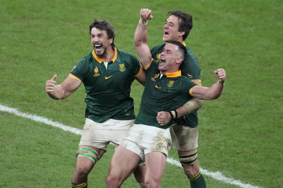 South Africa players celebrate at the end of the Rugby World Cup final match between New Zealand and South Africa at the Stade de France in Saint-Denis, near Paris Saturday, Oct. 28, 2023. (AP Photo/Themba Hadebe)