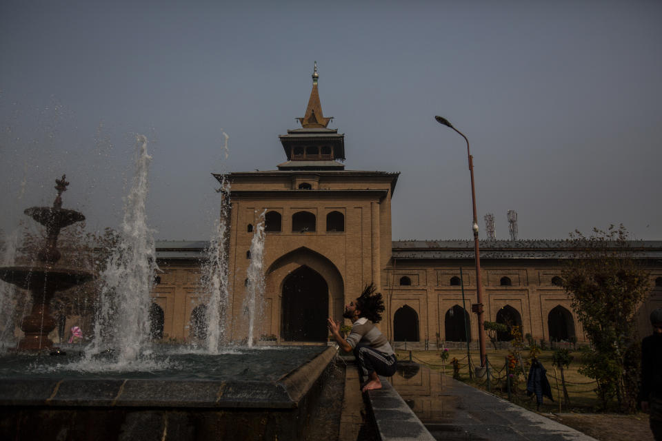 A Kashmiri man performs ablution before prayers outside the Jamia Masjid, or the grand mosque in Srinagar, Indian controlled Kashmir, Nov. 13, 2021. The mosque has remained out of bounds to worshippers for prayers on Friday – the main day of worship in Islam. Indian authorities see it as a trouble spot, a nerve center for anti-India protests and clashes that challenge New Delhi’s sovereignty over disputed Kashmir. For Kashmiri Muslims it is a symbol of faith, a sacred place where they offer not just mandatory Friday prayers but also raise their voice for political rights. (AP Photo/Mukhtar Khan)