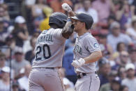 Seattle Mariners' Taylor Trammell, left, celebrates with Adam Frazier, right, after Frazier hit a two-run home run allowing them both to score in the sixth inning of a baseball game against the Boston Red Sox, Sunday, May 22, 2022, in Boston. (AP Photo/Steven Senne)