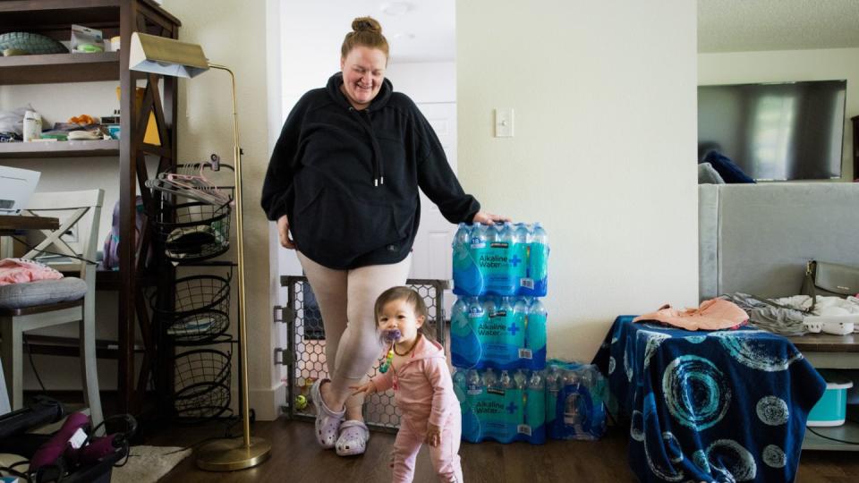 Heather Nguyen plays with her daughter, Chloe, in their home on Joint Base Lewis-McChord. (Dan Delong/InvestigateWest)