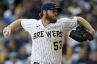 Milwaukee Brewers starting pitcher Brandon Woodruff throws against the Atlanta Braves during the first inning in Game 2 of baseball's National League Divisional Series Saturday, Oct. 9, 2021, in Milwaukee. (AP Photo/Aaron Gash)