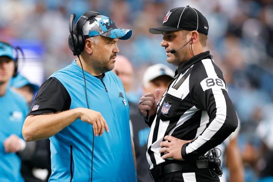 Carolina Panthers head coach Matt Rhule speaks with an official during a game against the Arizona Cardinals at Bank of America Stadium in Charlotte, N.C., Sunday, Oct. 2, 2022.