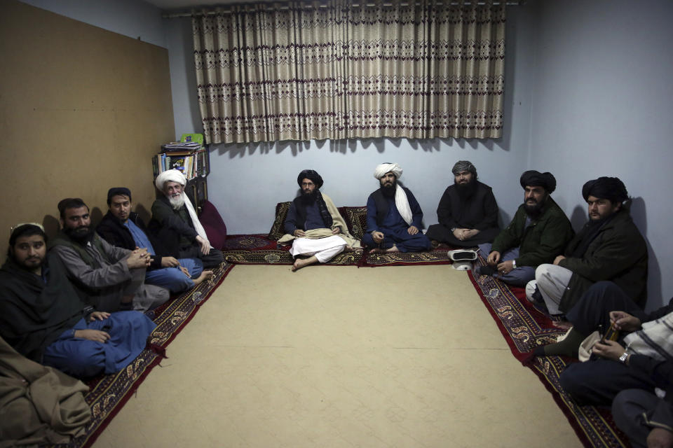 FILE - In this Dec. 14, 2019 file photo, jailed Taliban sit inside the Pul-e-Charkhi Jail after speaking with The Associated Press, in Kabul, Afghanistan. A three-member Taliban technical team arrived Tuesday, March 31, 2020, in the Afghan capital to oversee the release of their prisoners as part of a peace deal signed by the Taliban and the U.S., a spokesman for the insurgent group said. (AP Photo/Rahmat Gul, File)