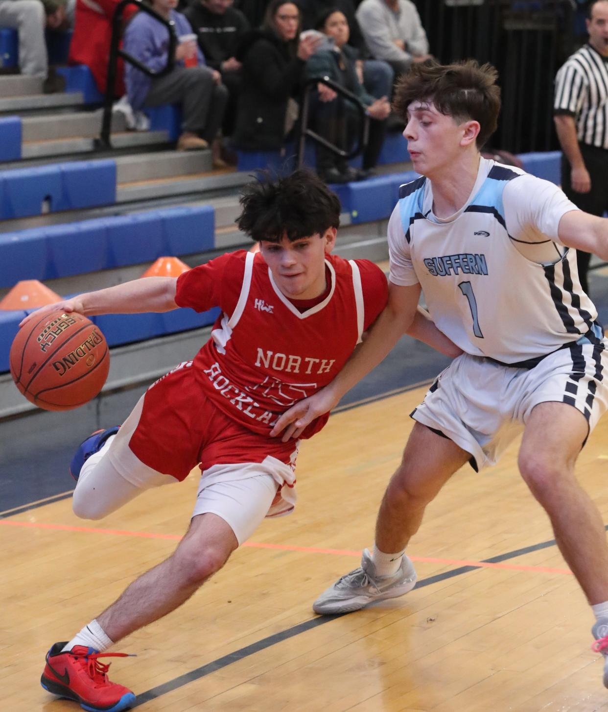 North Rockland's Aaron Rivera drives around Suffern's Mason Polombo during their game at at Suffern Feb. 6, 2024. North Rockland won 57-50.
