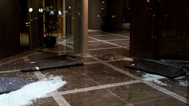 PHOTO: Broken glass remains on the floor at the Old National Bank on April 10, 2023 in Louisville, Ky. (Michael Swensen/Getty Images)