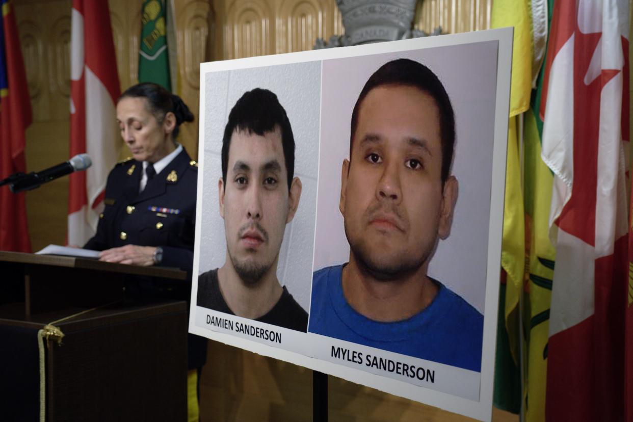 Assistant Commissioner Rhonda Blackmore speaks next to images of Damien Sanderson and Myles Sanderson during a press conference at the Royal Canadian Mounted Police "F" Division headquarters in Regina, Saskatchewan, on Sunday, Sept. 4, 2022. 