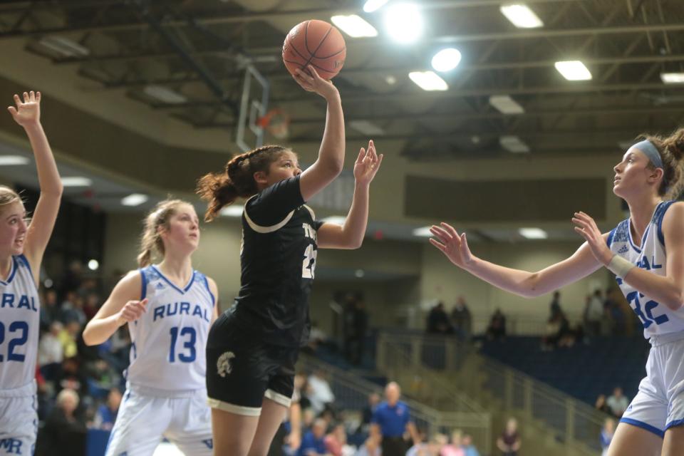 Topeka High senior Kiki Smith (23) shoots for two against Washburn Rural during the second half of Tuesday's game.