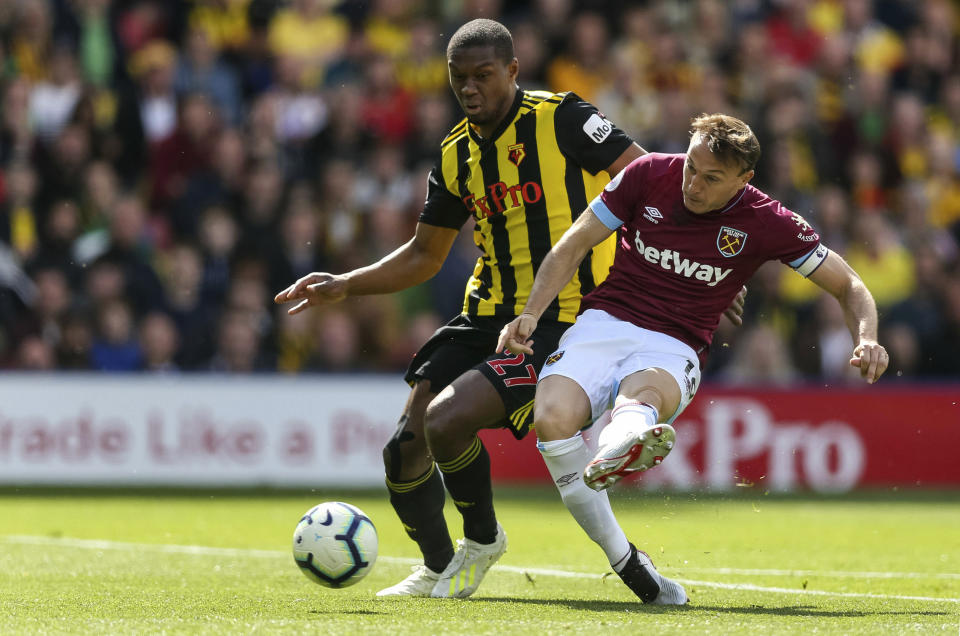 West Ham United's Mark Noble scores his side's first goal of the game during the English Premier League soccer match between Watford and West Ham United, at Vicarage Road, in Watford, England, Sunday, May 12, 2019. (Paul Harding/PA via AP)