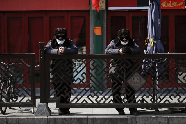 Security guards wearing protective face masks in Beijing 